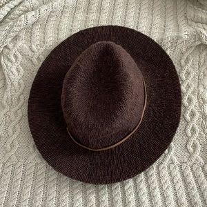 Women’s woven Brown Hat. Soft and comfortable. Shiny Gold band around it.